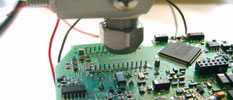 Figure 2. Infrared thermometer during temperature measurement of assembled circuit board.